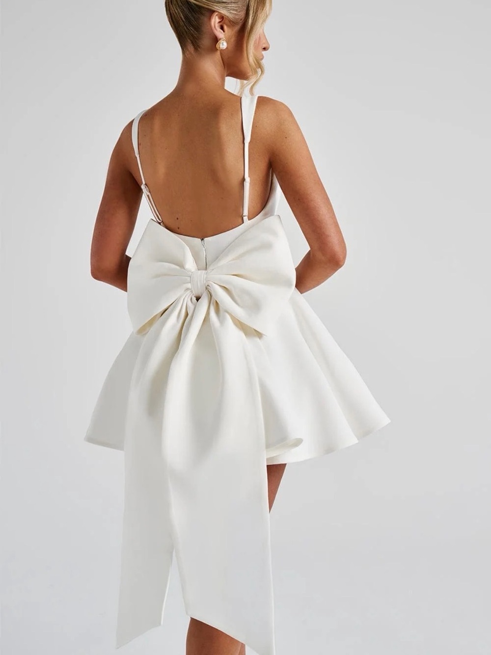 Bow-Back White Mini Dress with Dramatic Bow Detail